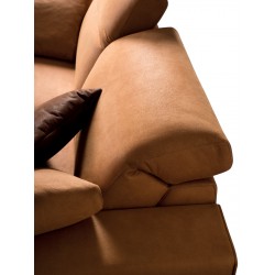 Padded sofa with reclining headrest - One